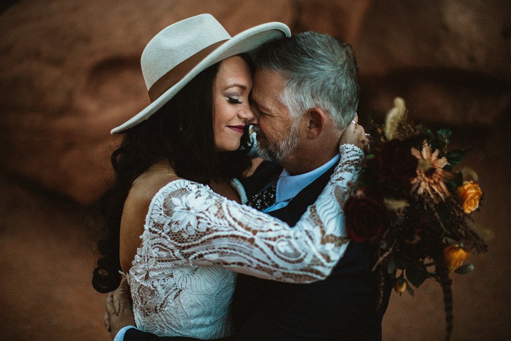 Couple eloping in garden of the gods with dried flowers