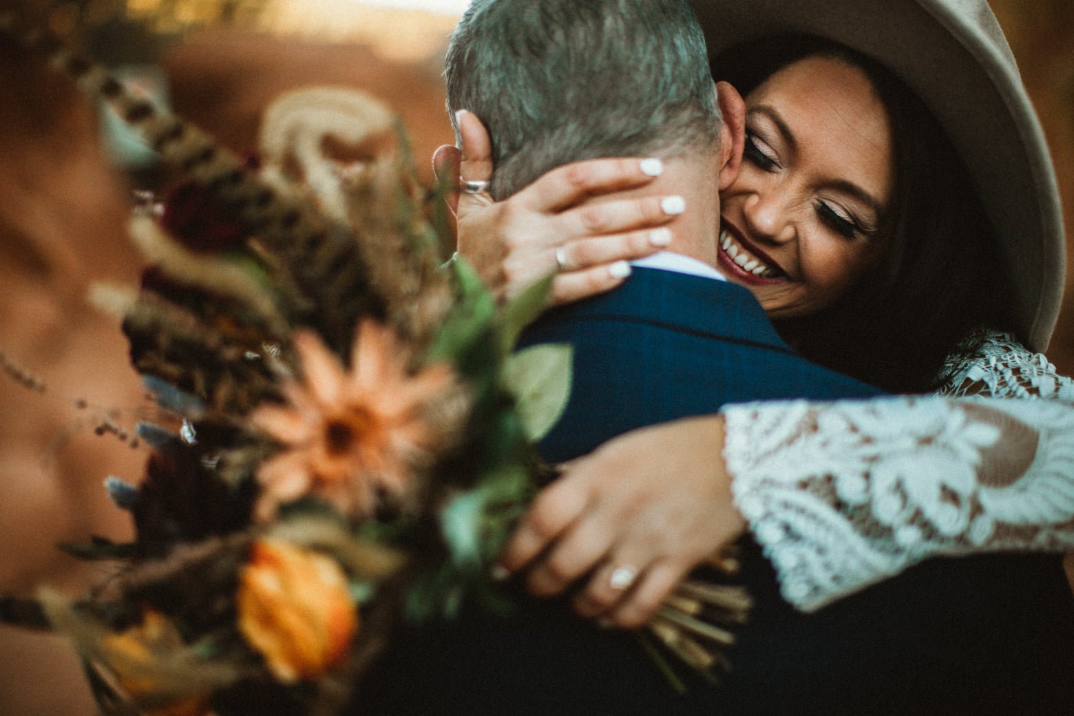 garden of the gods sunrise  elopement written vows hugging with flowers